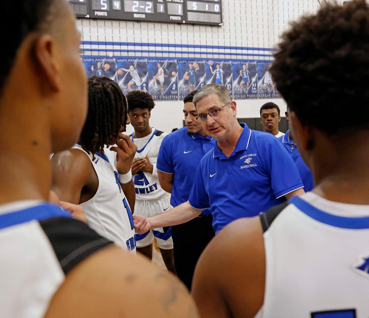North Crowley head coach Tommy Brakel talks to the team during a time out in the fourth period of a UIL basketball game at North Crowley High School in Fort Worth, Texas, Tuesday, Feb. 13, 2024.