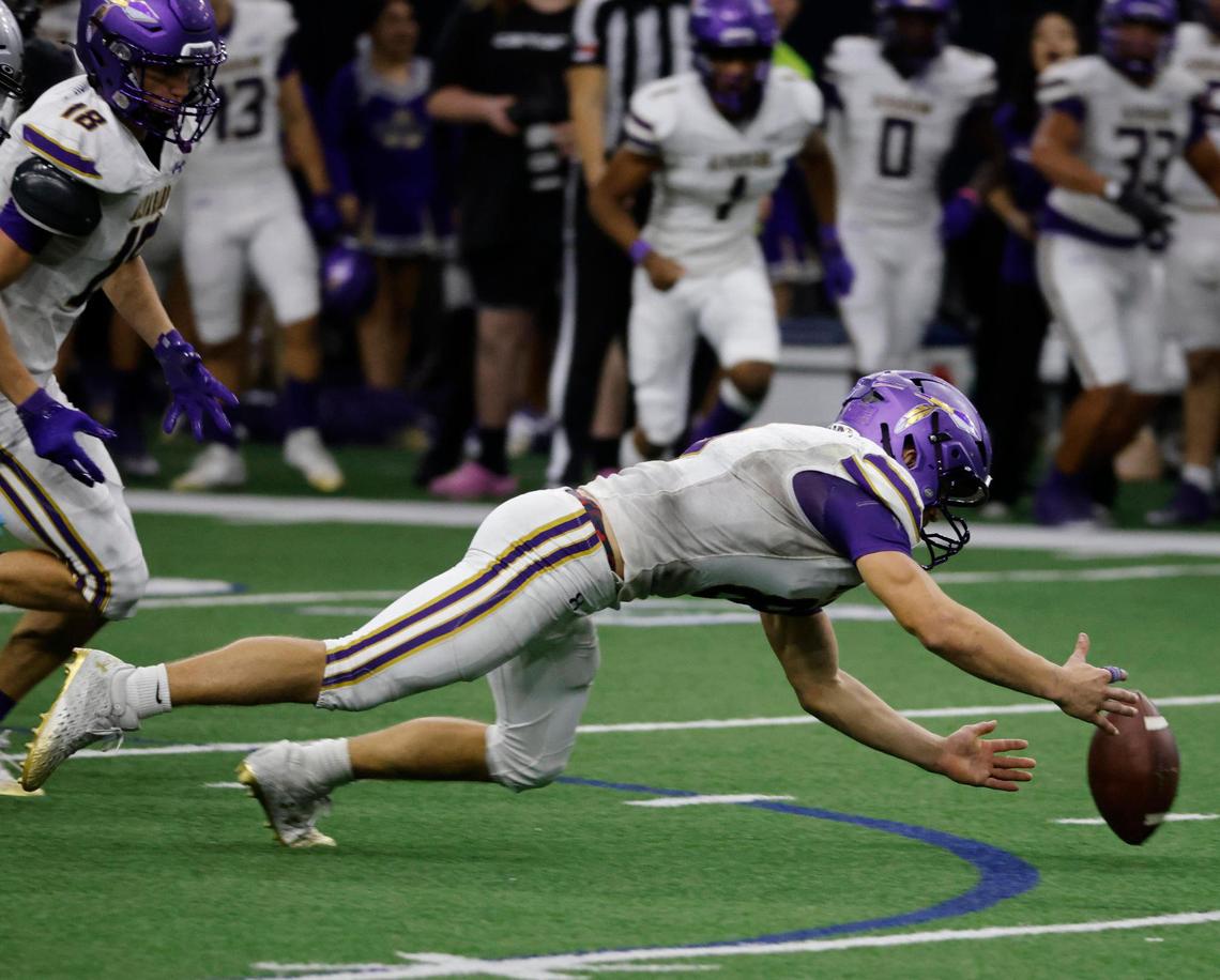 Alvarado athlete D.J. Clampitt (8) recovers an onside kick during a UIL 4A D1 Area round football playoff game at The Ford Center in Frisco Texas, Thursday, Nov. 21, 2024.