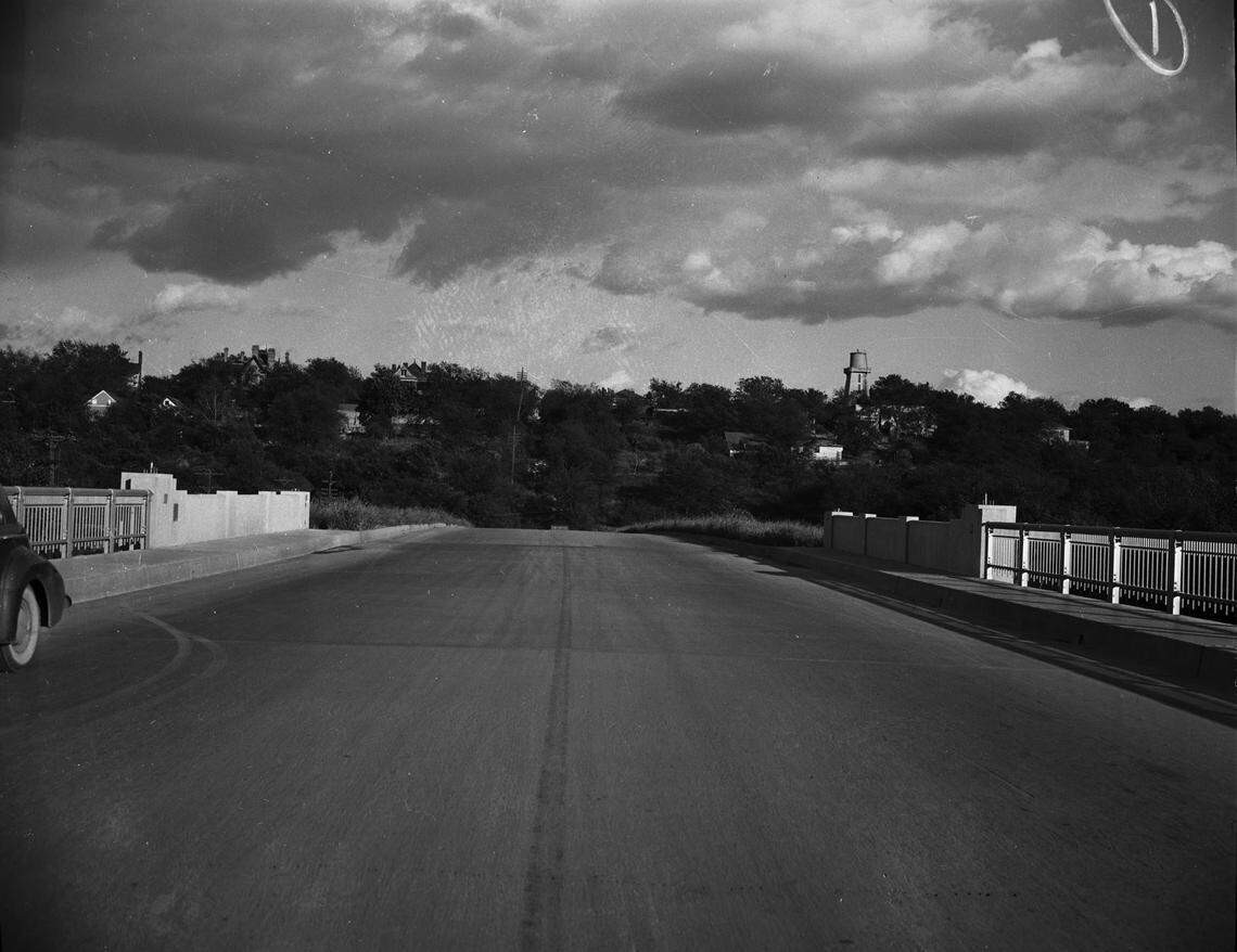 Nov. 7, 1941: West Lancaster Avenue in Fort Worth, where a new link between Penn Street bluff and the Trinity River Bridge will be constructed. In the distance many trees can be seen along with a few houses. The construction will be completed by the Dallas, Texas, contracting firm of Ben Sira and Company.
