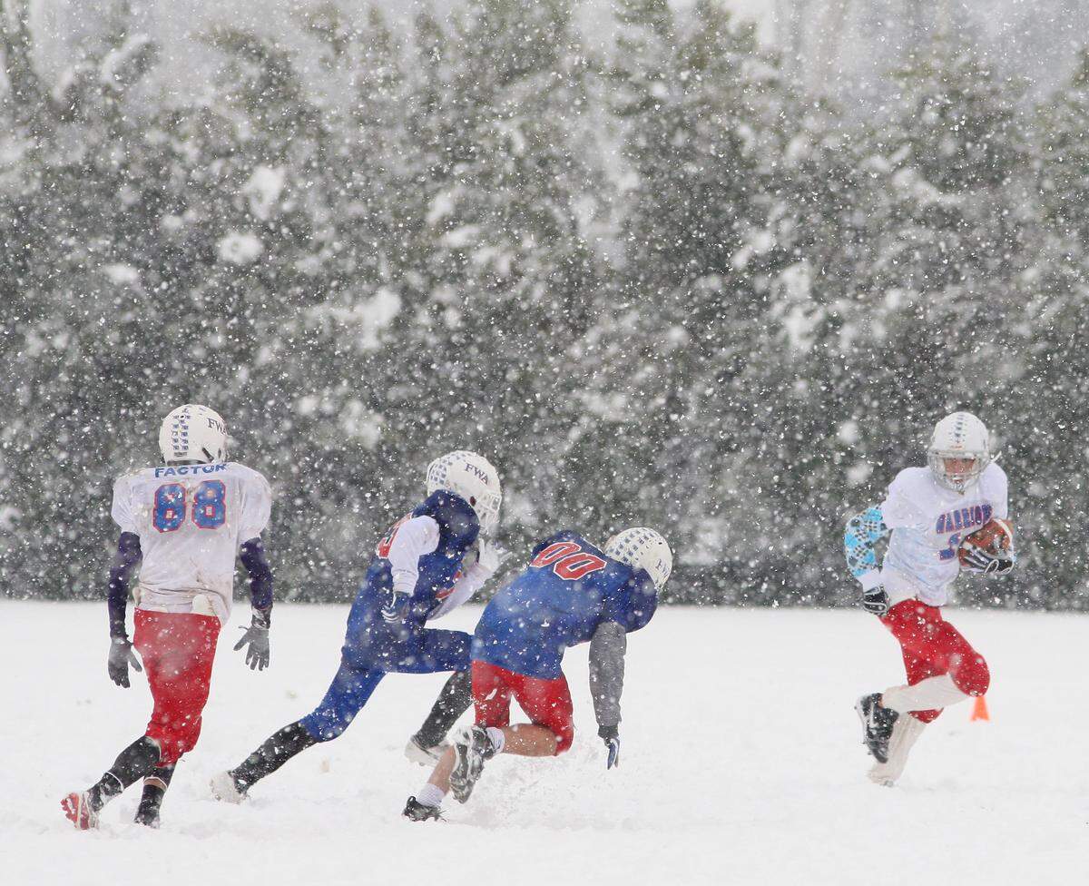 A small group played football on the fields on the west side of TCU near the tennis courts. Snow coverage in Fort Worth, photographed Thursday, Feb. 11, 2010.