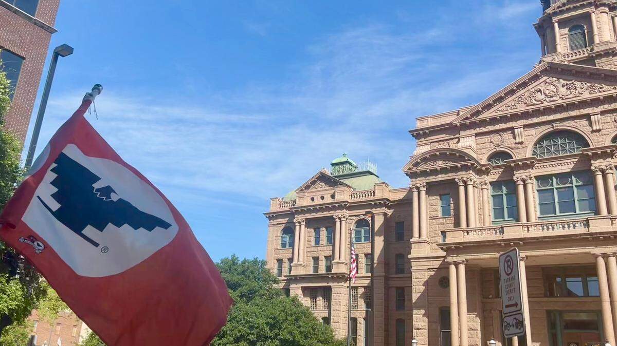 A United Farm Workers of America flag flies in front of the Tarrant County Courthouse on Aug 18, 2024 during a press conference and protest against Tarrant County looking to swap Cesar Cahvez day on it’s calendar in favor for veterans day. The symbol has become synonymous Chavez who helped found the organization in the 1960’s.