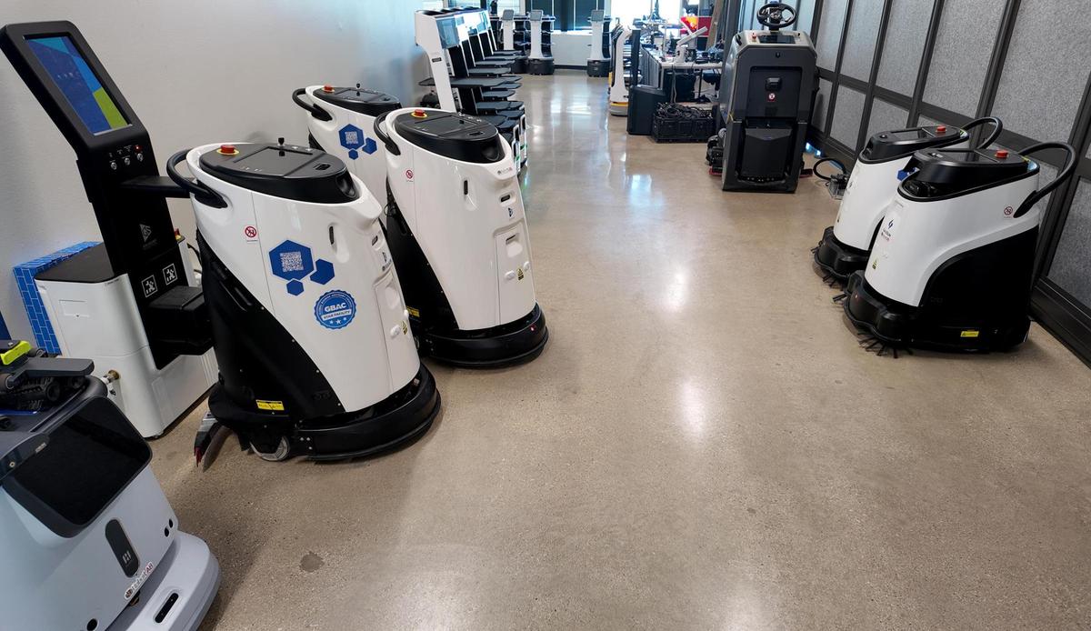A hallway of cleaning robots at RobotLAB’s Southlake office on Wednesday, April 23, 2025. These machines can vacuum, mop, steam and sweep a multitude of surfaces.