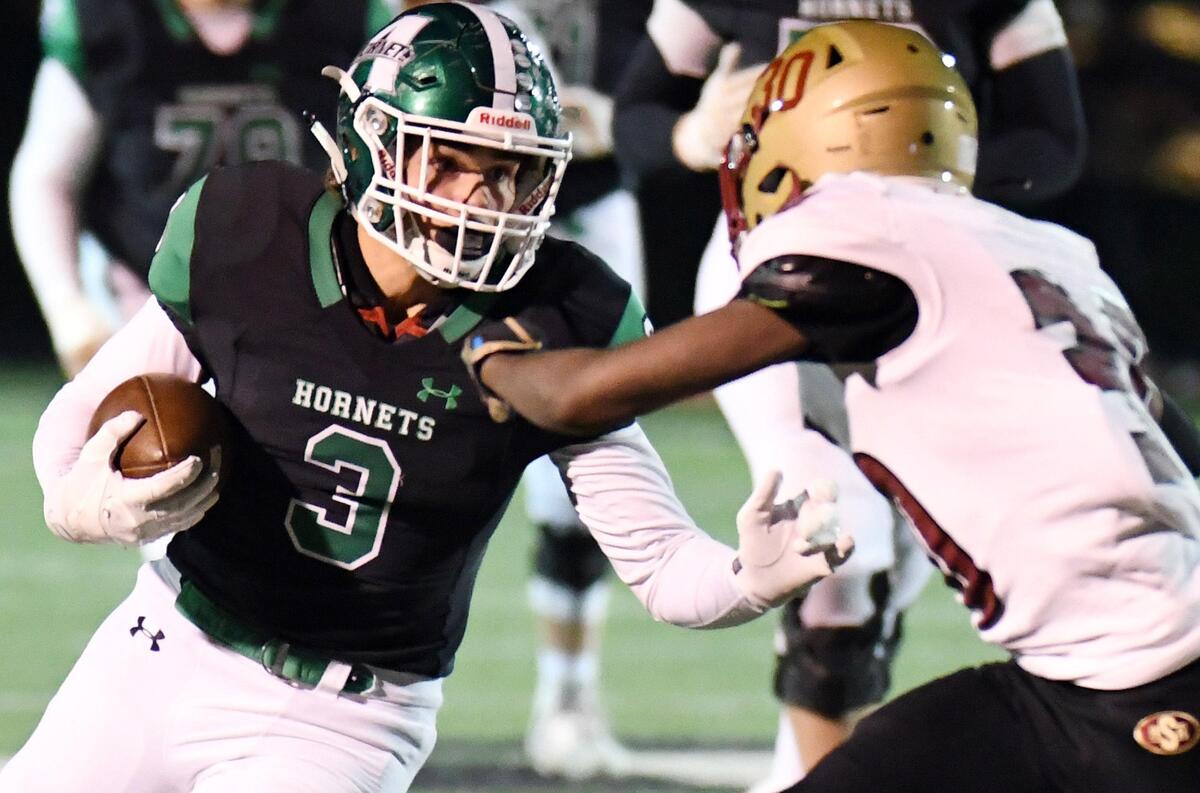 Azle’s Jacob Lee left, faces off against Saginaw’s Ja’kques Goff as he rushes for a first down in the second quarter during Friday’s November 1, 2019 football game at Hornet Stadium in Azle, Texas.
