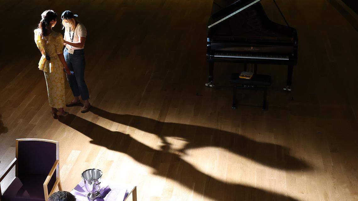 Elizabeth Joy Roe, who is hosting a webcast at the Cliburn International Piano Competition, is wired for sound before a recording session at TCU. Preliminary-round recitals begin Thursday.