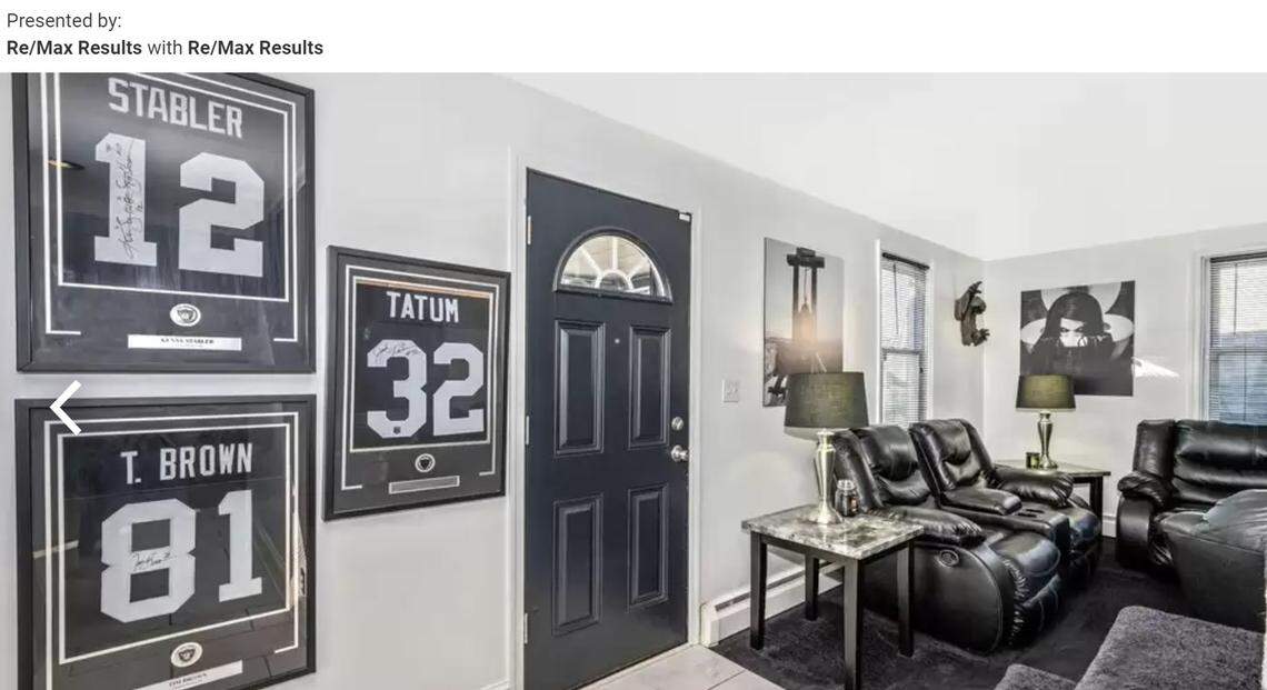 Las Vegas Raiders line the wall near the front door