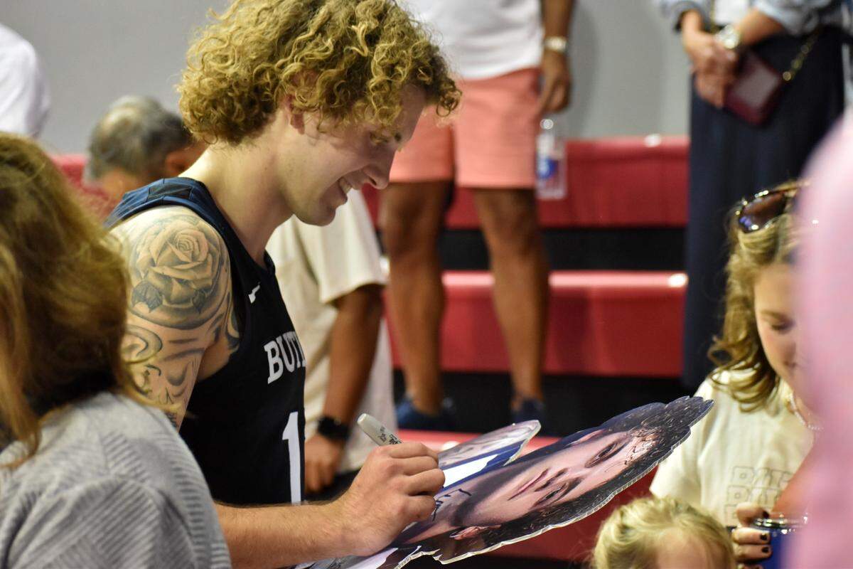 Butler’s Finley Bizjack signs a cutout of his face after a game against SMU on Nov. 15 at Moody Coliseum in Dallas.