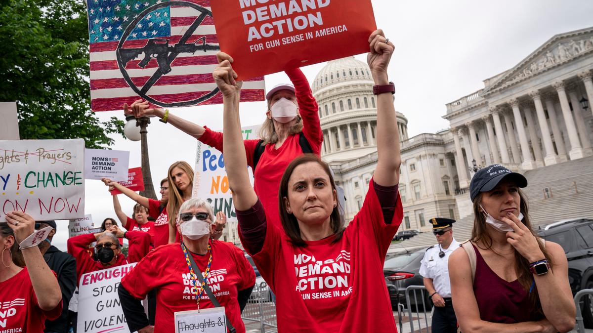 Activists join Senate Democrats outside the Capitol to demand action on gun control legislation after a gunman killed 19 children and two teachers in a Texas elementary school this week, in Washington, Thursday, May 26, 2022. A bipartisan group of senators is considering how Congress should respond to the horrific shooting of 19 children and two teachers in Uvalde, Texas. (AP Photo/J. Scott Applewhite)