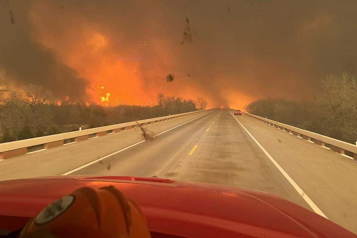 The Smokehouse Creek wildfire is seen from a fire truck on Tuesday, Feb. 27, 2024 near Wheeler, Texas.