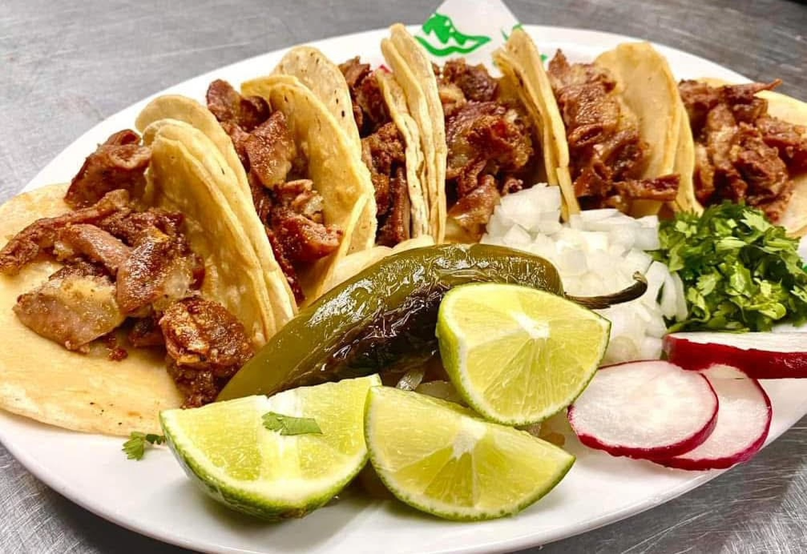 Tacos alongside raddish, limes, cilantro and onion at La Unión Restaurant 2 in Fort Worth, July 29, 2025. Meat options include tripa, asada, pastor, barbacoa, carnitas and QuesoBirria tacos.