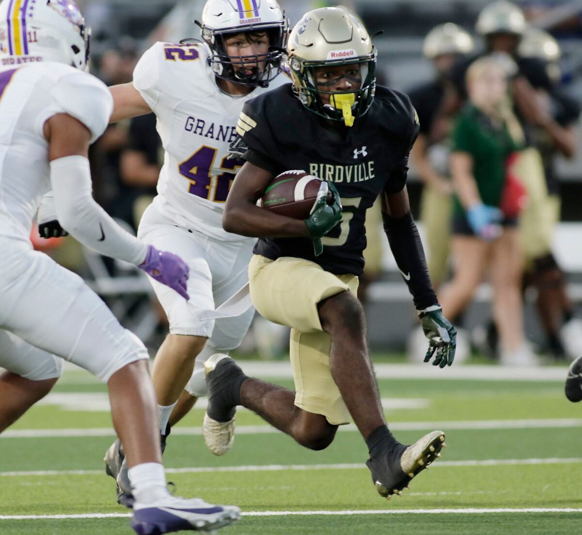 Birdville’s Jordan Hicks looks for running room against the Grandbury defense during their game Thursday night at Birdville Athletic Center. JOHN ROWLAND