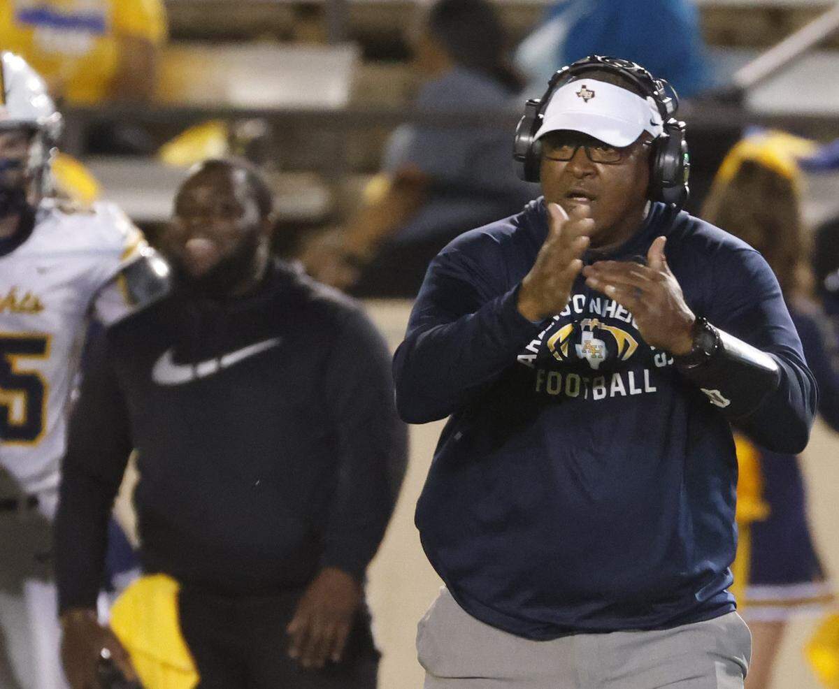 Arlington Heights head coach Curtis James calls for a time out during the first half of a UIL football game between Arlington Heights and Paschal at Farrington Field in Fort Worth, Texas, Friday Nov. 07, 2025.
