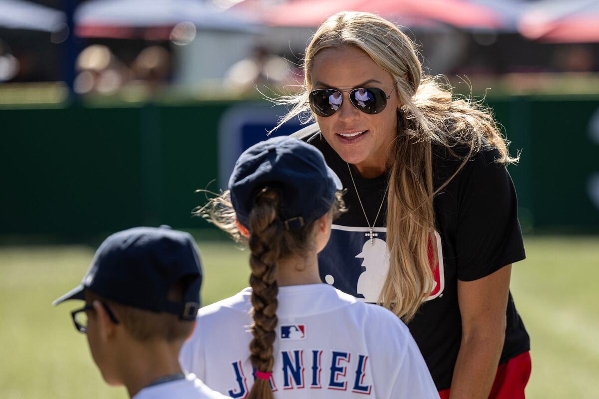 Olympics Gold Medalist Softball player Jennie Finch talks to a young fan during the opening ceremony for the first day of the 2024 MLB All-Star Village at Choctaw Stadium in Arlington on Saturday, July 13, 2024.