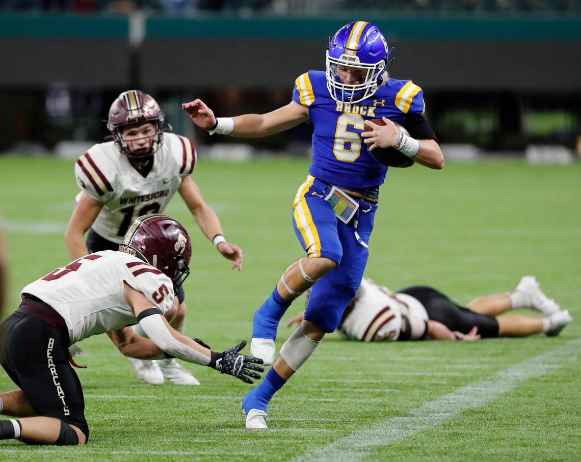 Brock quarterback Tyler Moody (6) avoids the shoestring tackle stepping out of bounds during a high school Class 3A Division 1 Quarterfinals playoff game at Globe Life Field in Arlington, Texas, Thursday, Dec. 02, 2021. Brock led 28-0 at the half. (Special to the Star-Telegram Bob Booth)