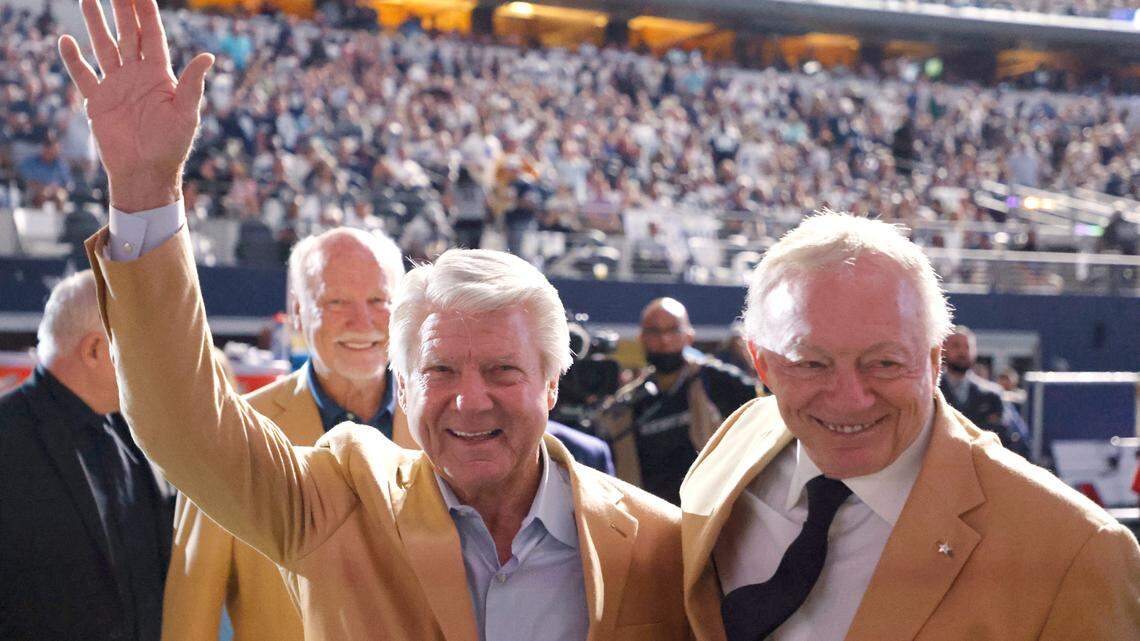 Jimmy Johnson and Jerry Jones hug during a halftime of an NFL football game between the Dallas Cowboys and the Philadelphia Eagles in Arlington in 2021.
