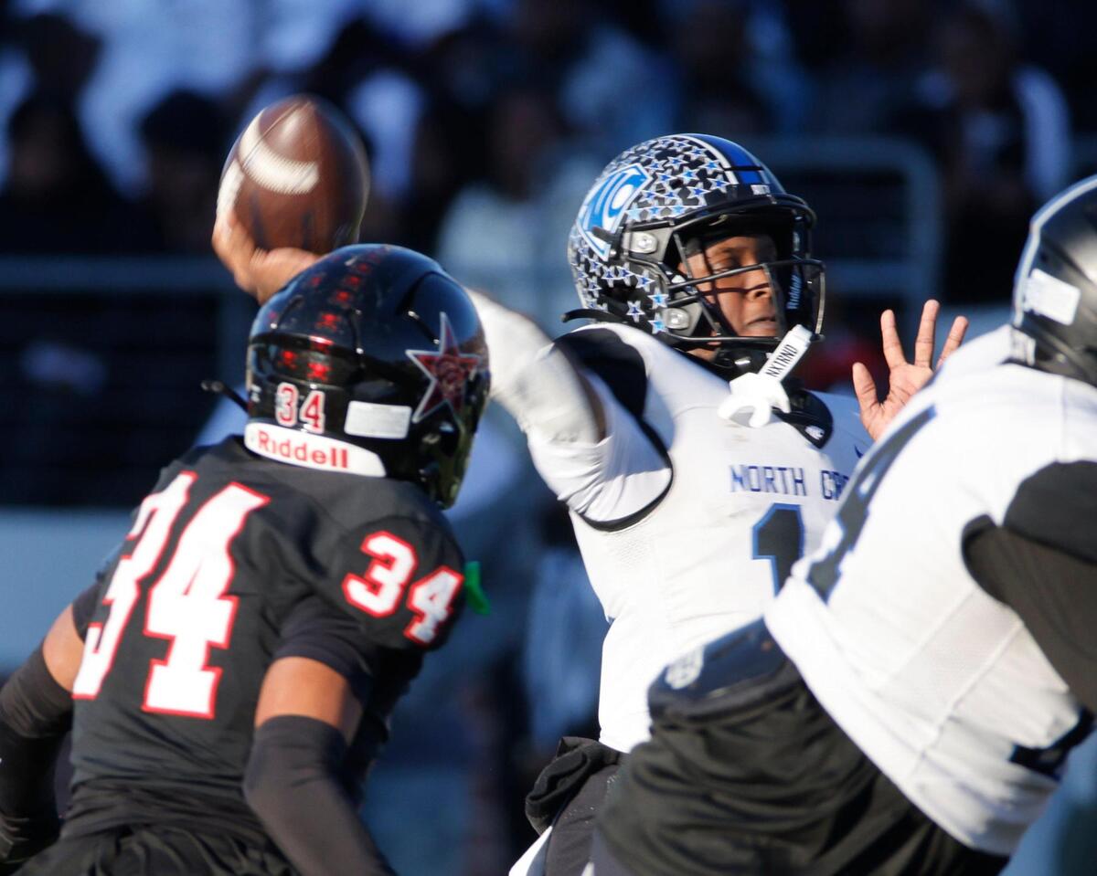 North Crowley quarterback Chris Jimerson (12) tosses to the corner of the end zone during the UIL District 6A D1 Regional football game at Vernon Newsom Stadium in Mansfield, Texas, Saturday, Nov. 30, 2024.
