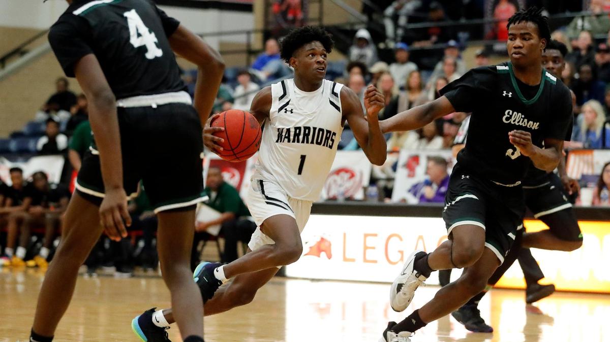 Arlington Martin shooting guard Jeremiah Charles (1) splits Killeen’s defense in the second half of the Orange division of the Whataburger Tournament basketball championship game at Mansfield Legacy high school in Mansfield, Texas, Friday, Dec. 30, 2022. The Eagles outscored the Warriors by five in the second half to defeat Martin 48-41. (Special to the Star-Telegram Bob Booth)