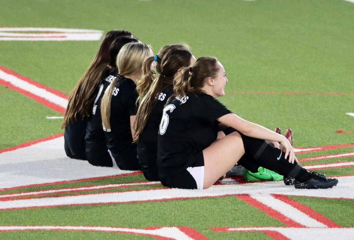 Colleyville Heritage soccer players sit at midfielder in a game against Birdville at Colleyville Heritage High School in Colleyville, Texas, on Monday, March 10, 2025.