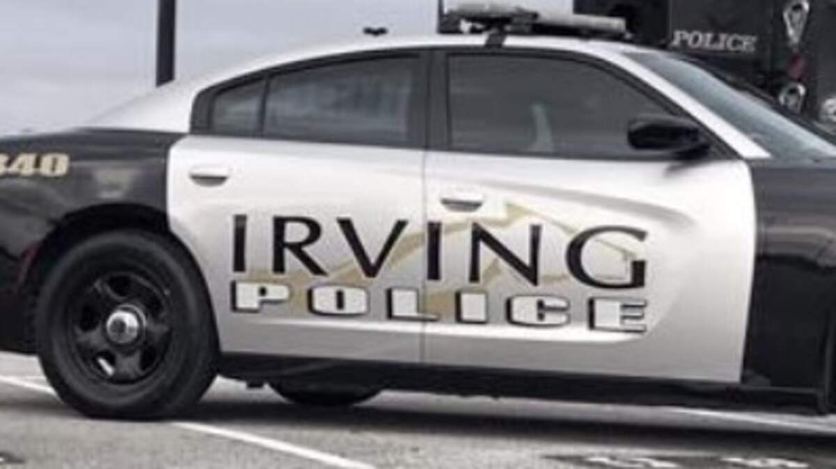 A man who had a warrant out for his arrest was hospitalized Thursday after an officer fired their weapon at a car speeding on a highway that contained the suspect, according to Irving police. 