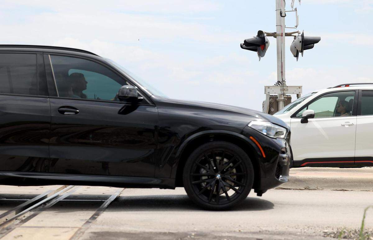 Vehicles cross the BNSF railroad tracks on Bonds Ranch Road just west of Highway 287 on Monday, June 5, 2023, in Tarrant County. The Federal Railroad Administration has allocated $17 million to TxDOT to build a four-lane road across the BNSF tracks. Roughly 18,000 vehicles use Bonds Ranch Road every day, according to the state Transportation Department.