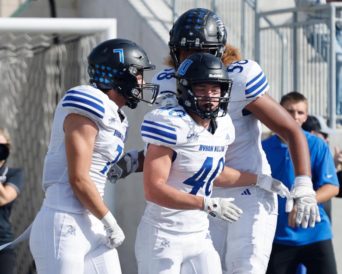 Byron Nelson running back Anthony Sexton (40) is congratulated by team mates after tying the game at seven during a UIL Class 6A D1 Bi-district playoff football game at Crowley ISD Multi-Purpose Stadium in Fort Worth, Texas, Saturday, Nov. 16, 2024.