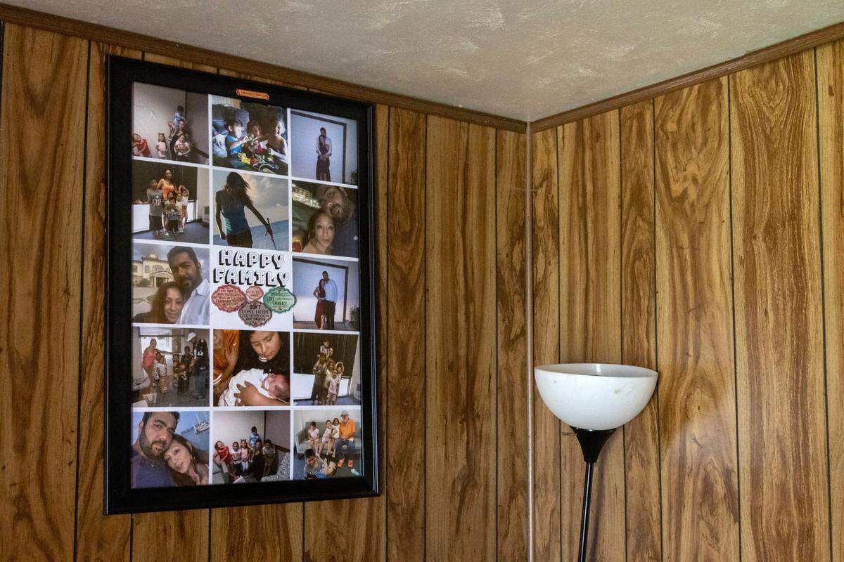 A photo inside Robert Parson’s home that shows him with and Cindy Rodriguez-Singh and her family, including Noel Rodriguez-Alvarez in the blue shirt, in Everman, Texas, on Tuesday, March 28, 2023. Noel has not been seen since November 2022, and police thoroughly searched the home during their investigation.