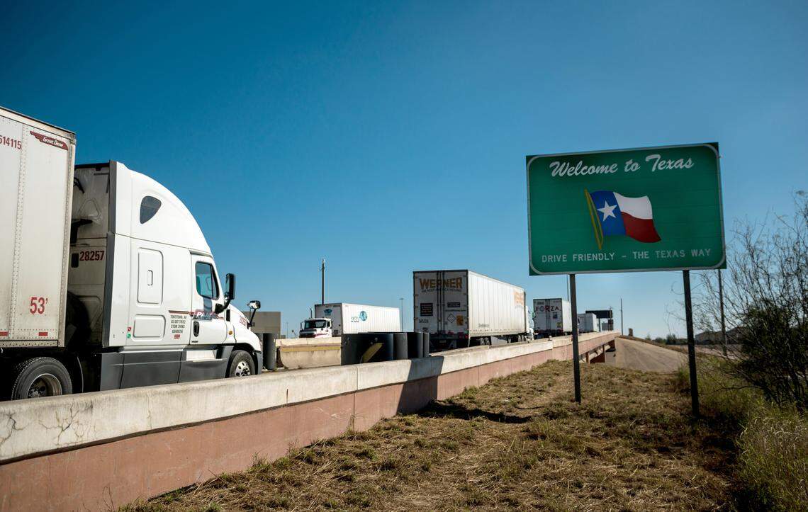 Trucks enter Laredo, Texas, after crossing from Nuevo Laredo, Mexico.