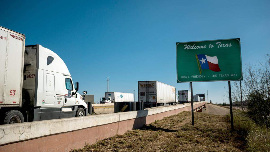 Trucks enter Laredo, Texas, after crossing from Nuevo Laredo, Mexico.