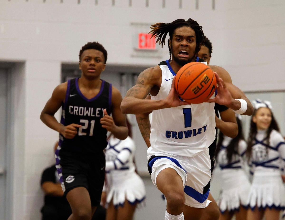 North Crowley wing KD Davis (1) pushes the ball ahead during the first period of a UIL basketball game at North Crowley High School in Fort Worth, Texas, Tuesday, Feb. 13, 2024.