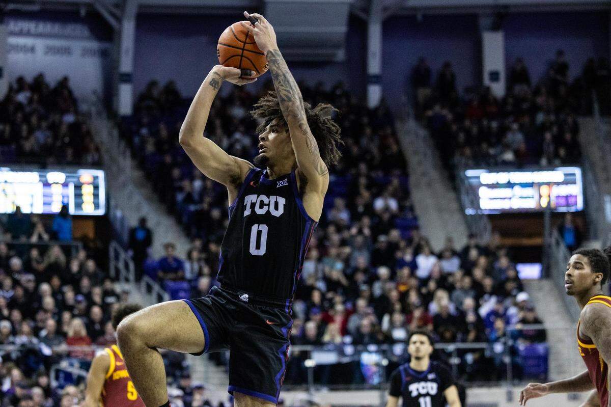 TCU guard Micah Peavy (0) goes up for a fadeaway jumper in the second half of a Big XII conference game between the TCU Horned Frogs and Iowa State Cyclones at Schollmaier Arena in Fort Worth on Saturday, Jan 20, 2024. TCU lost the game 73-72.