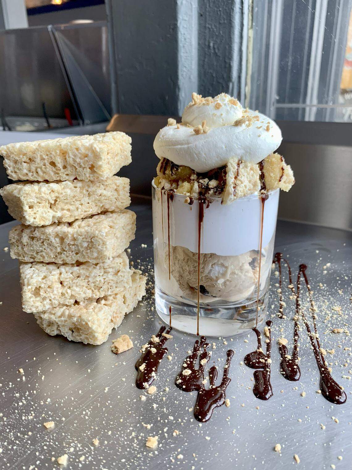 The Scoop and Scootery’s The Garland sundae. This has campfire smores ice cream topped with marshmallow fluff, frosted rice crispy treats, doughy sugar cookie bites, fudge, graham crackers and whipped cream.