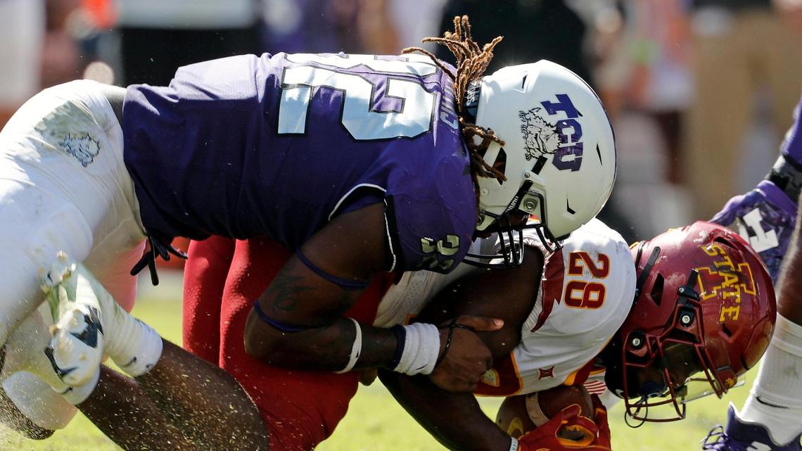 TCU defensive end Ochaun Mathis (32) brings down Iowa State running back Breece Hall (28) for a loss in the second half of a NCAA football game at Amon G. Carter Stadium in Fort Worth, Texas, Saturday, Sept. 26, 2020. Mathis has seven tackles for loss and a team-high four sacks through six games.