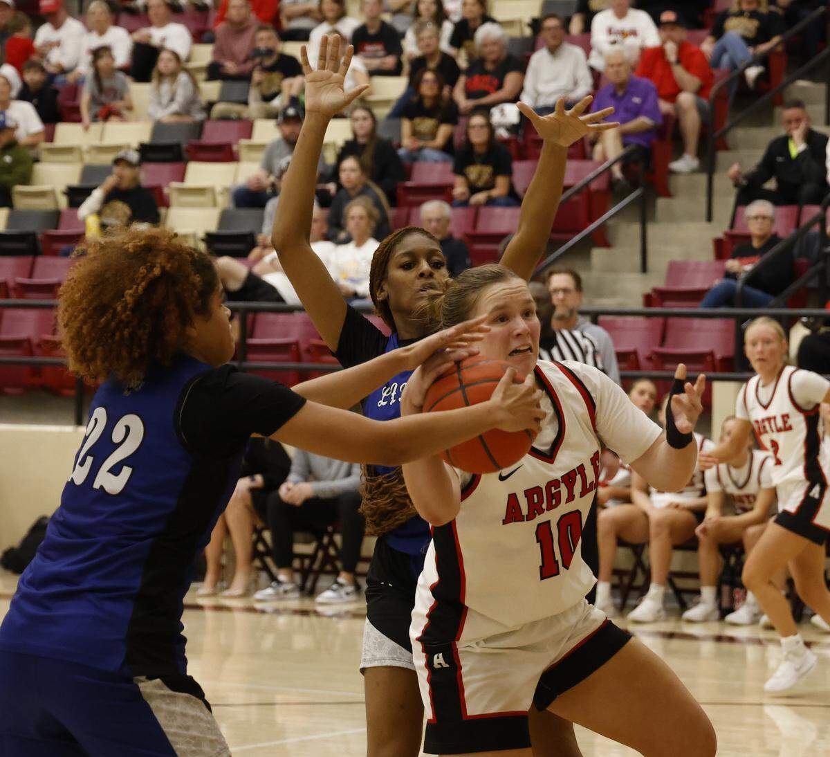 Mansfield Summit forward Maya Wiliams (22) grabs the ball from Argyle forward Emma King (10) during the second half of a UIL Class 5A DII girls playoff basketball game at Saginaw High School in Saginaw, Texas, Thursday Feb. 19, 2026.