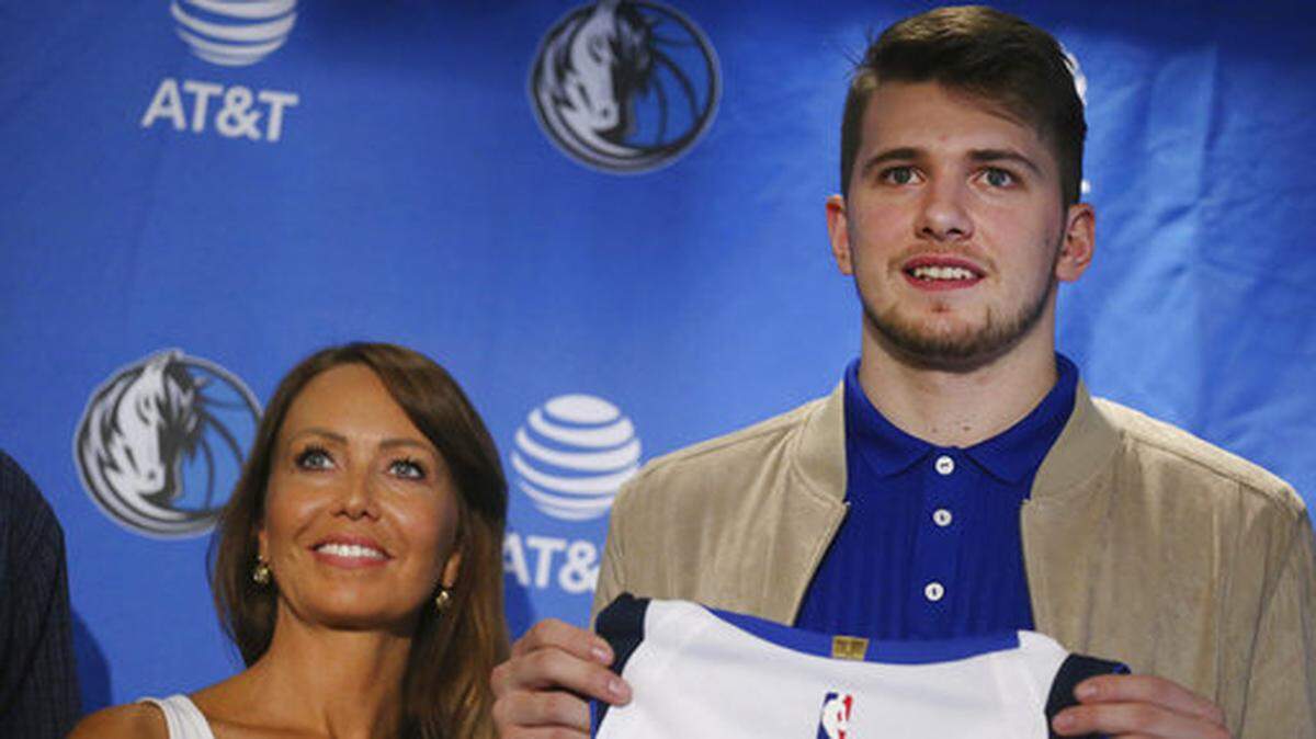 Mirjam Poterbin stands with her son Luka Doncic after he was introduced to reporters by the Dallas Mavericks in Dallas on Friday, June 22, 2018, the day after the first two rounds of the NBA draft.