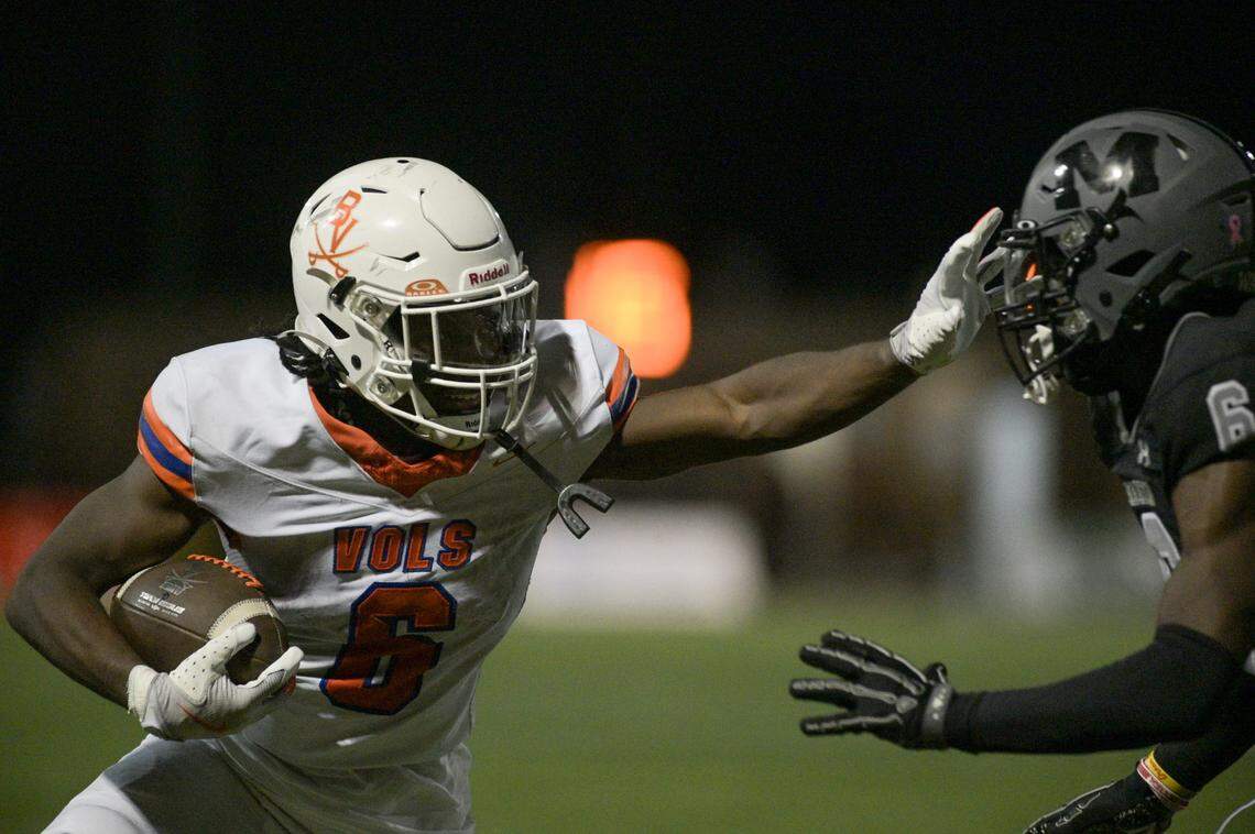 Bowie Volunteer running back Darrion Bowers (6) goes for a stiff arm as Martin defensive back Kevin Grant (6) approaches during a UIL football game against Martin High School at Cravens Field in Arlington, Texas on Friday, Oct. 11, 2024