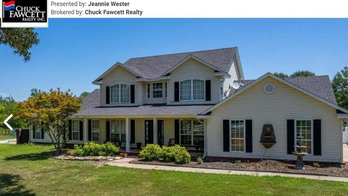 The home has a charming exterior that rests against the rolling green countryside.