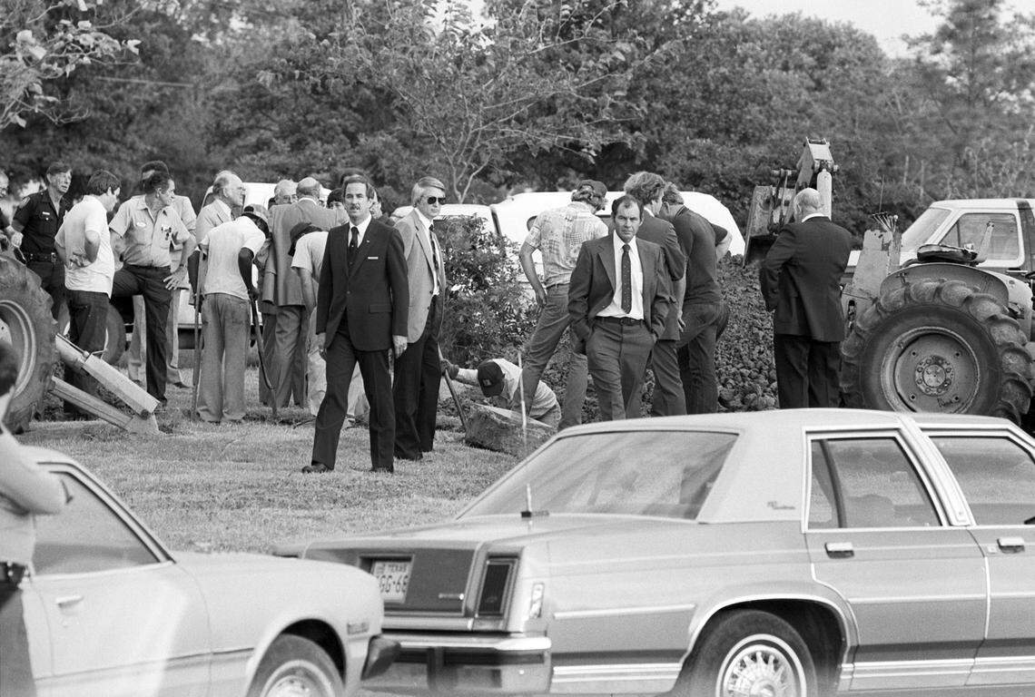 Oct. 4, 1981: A crowd of people, some with shovels, are seen attending the exhumation of Lee Harvey Oswald at Rose Hill Memorial Park in Fort Worth, Texas.