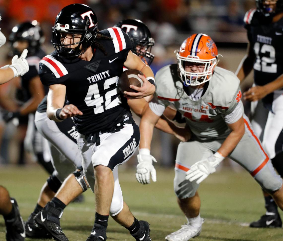 Trinity fullback Joseph Luna (42) attacks the middle of the line during the second half of a high school football game at Pennington Field in Bedford, Texas, Friday, Oct. 04, 2019. Trinity defeated San Angelo Central 49-24. (Special to the Star-Telegram Bob Booth)