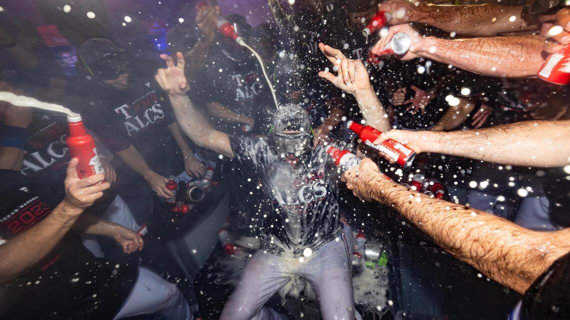 Texas Rangers pitcher Nathan Eovaldi gets beer and champagne poured on him while celebrating a win in game three to clinch the ALDS between the Texas Rangers and Baltimore Orioles at Globe Life Field in Arlington on Tuesday, Oct. 10, 2023.