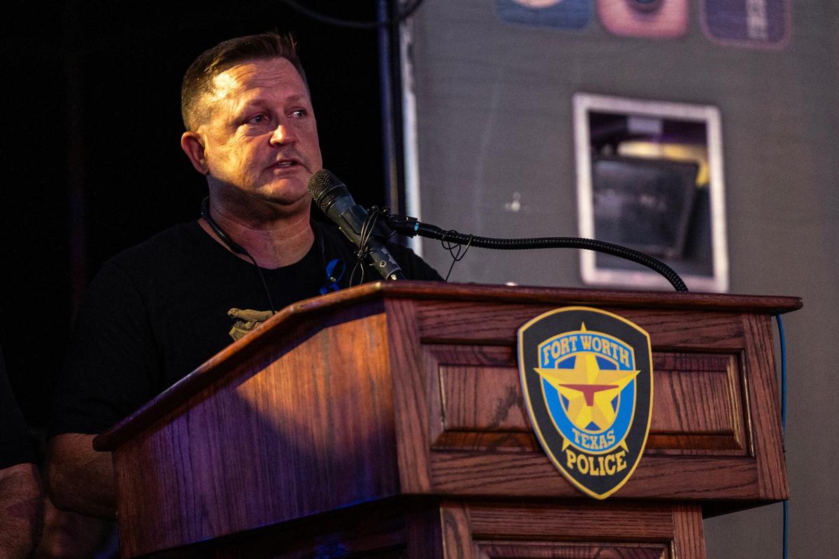 Matt Randolph, the little brother of Fort Worth Police Department Sgt. Billy Randolph, says words about him in his memory during his honorary candlelit vigil at the Fort Worth PD South Division headquarters in Fort Worth on Wednesday, Aug. 14, 2024.