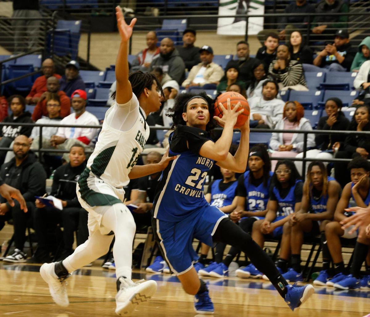 North Crowley guard Isaak Hayes (22) prepares to get a shot off during a UIL boys basketball game at Lake Ridge High School in Mansfield, Texas, Tuesday, Jan. 24, 2025.