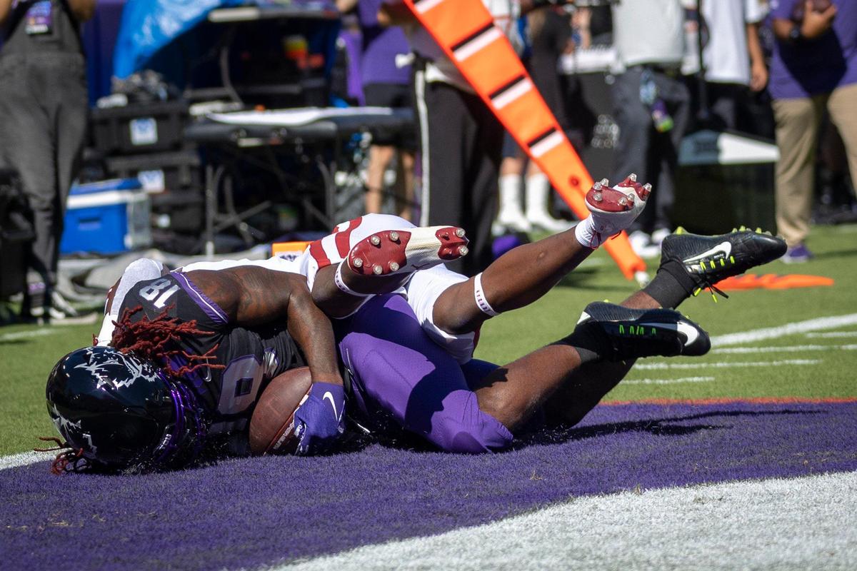 TCU wide receiver Savion Williams runs through OU cornerback Jaden Davis to score a touchdown at the Amon G. Carter Stadium in Fort Worth, Texas, on Saturday, Oct. 1, 2022.