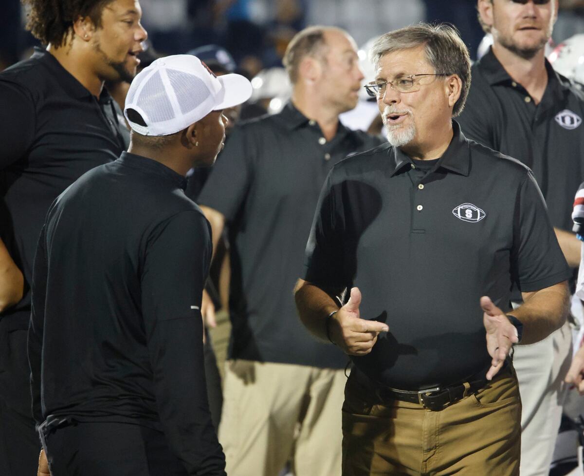 All Saints head coach Aaron Beck talks with Lift for Life Academy head coach Tony Woolfolk after a TAPPS football game at All Saints High School’s McNair Stadium in Fort Worth Thursday, Sept. 12, 2024.