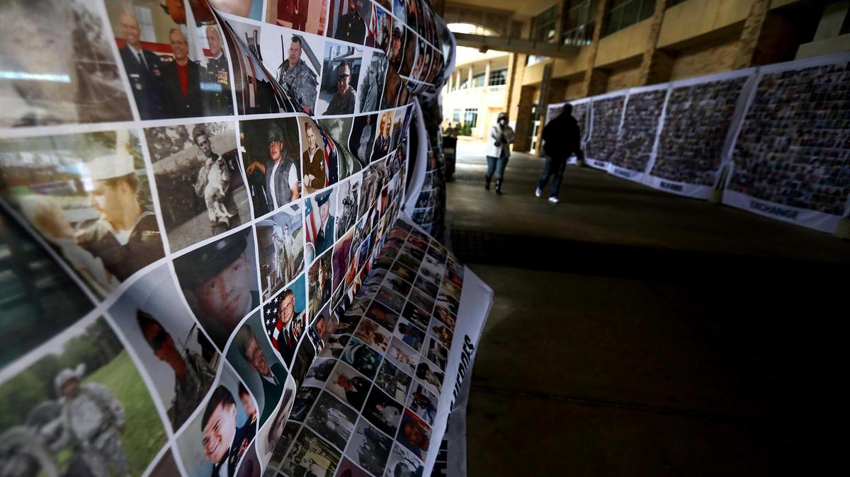Portraits of service men and women in the U.S. Armed Forces form the Wall of Heroes along a walkway at Amon G. Carter Stadium. Tulsa and Mississippi State played in the Armed Forces Bowl on Thursday.