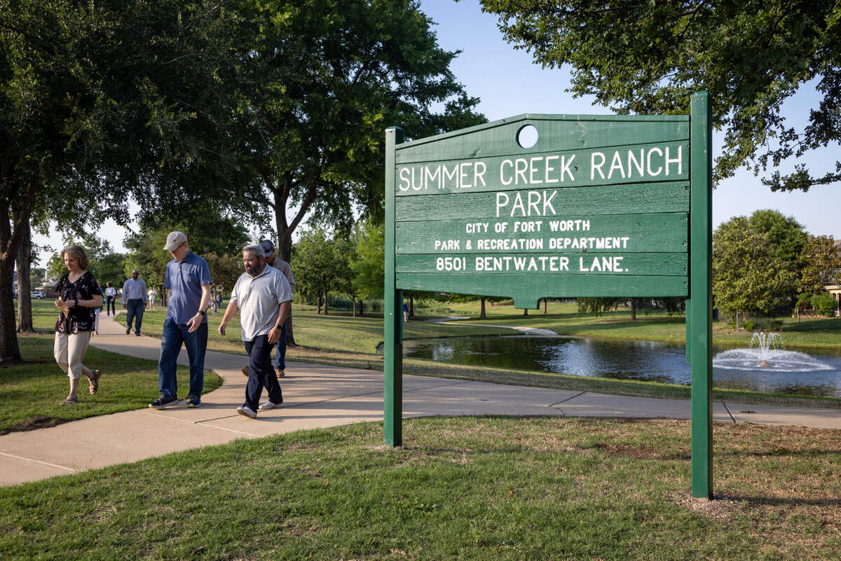 People leave a memorial dedication for Meg and Ben Arbour in the Summer Creek Ranch neighborhood of Fort Worth on Wednesday, May 3, 2023. The couple was killed in a car accident caused by two vehicles racing at night in November 2020.