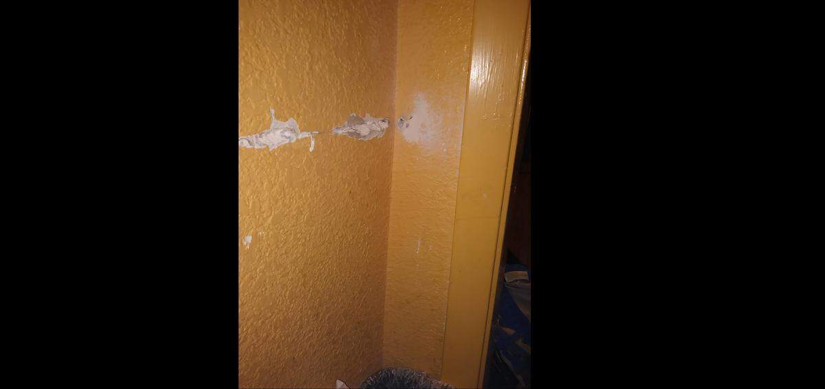 After a bullet pierced the wall of a room at the Knights Inn, narrowly missing a 23-yer-old woman lying on the bed, it ricocheted off an opposite wall and became lodged.