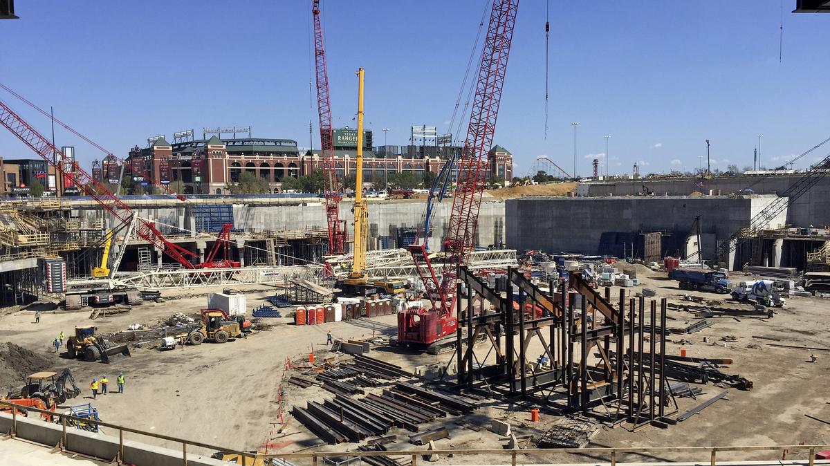 Globe Life Park is in the background of Globe Life Field during the One Million Workhours celebration for Globe Life Field September 18, 2018. The short orange pillions represent the bases in the infield. Over 900 workers were treated to lunch and visits from almost a dozen Texas Rangers players and manager.
