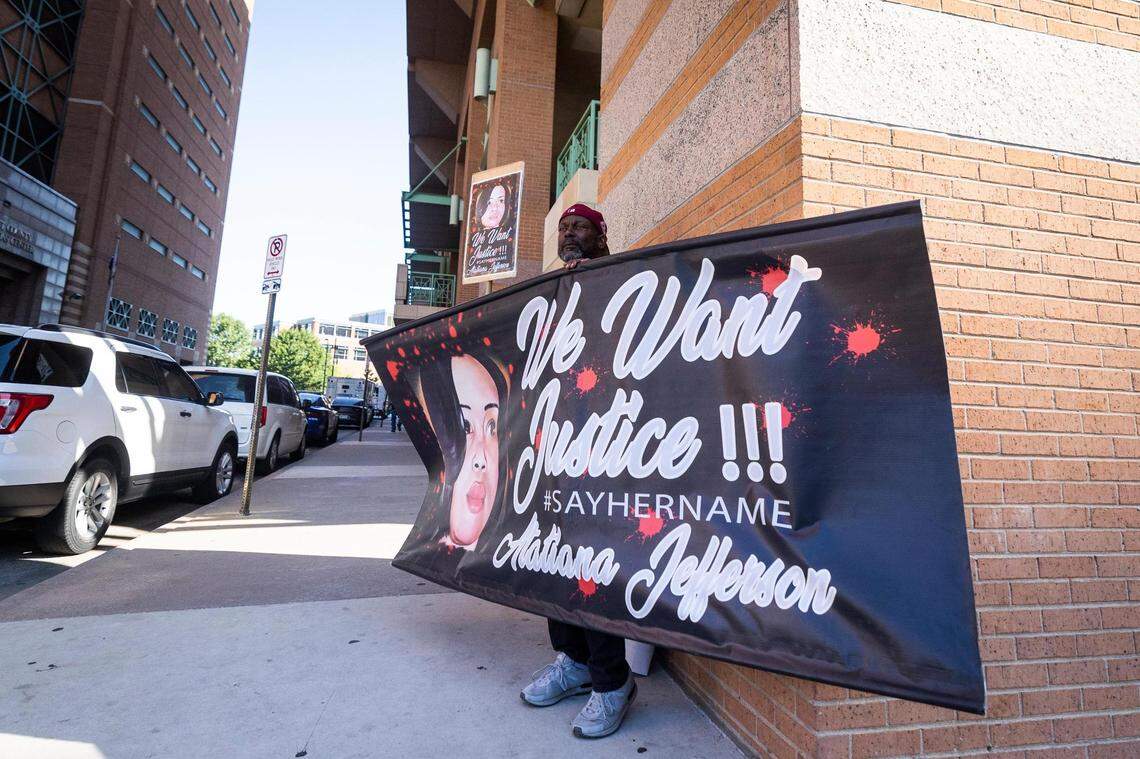 James Smith holds up a sign for Atatiana Jefferson as a recusal hearing is happening on Judge David Hagerman’s status in the Aaron Dean case on June 23, 2022, in Fort Worth.