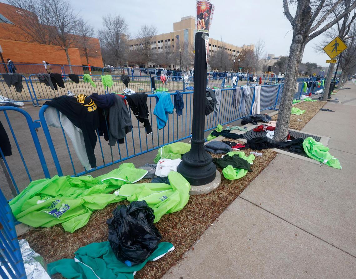 After runners left the starting line the street was filled with discarded clothing during the 2025 Cowtown at the Will Rogers Memorial Center in Fort Worth, Texas, Sunday, Feb. 23, 2025.