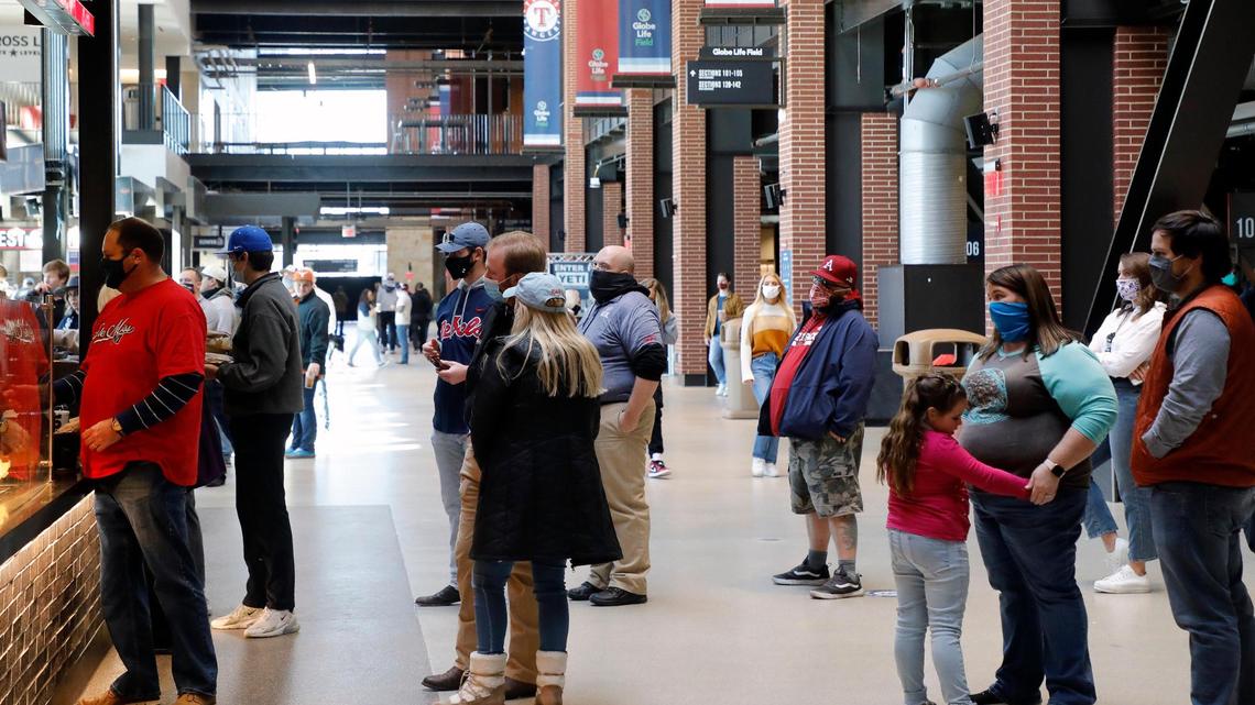 Baseball fans line up for concessions during the 2021 College Baseball Showdown at Globe Life Field in Arlington, Texas on Saturday, Feb. 20, 2021.