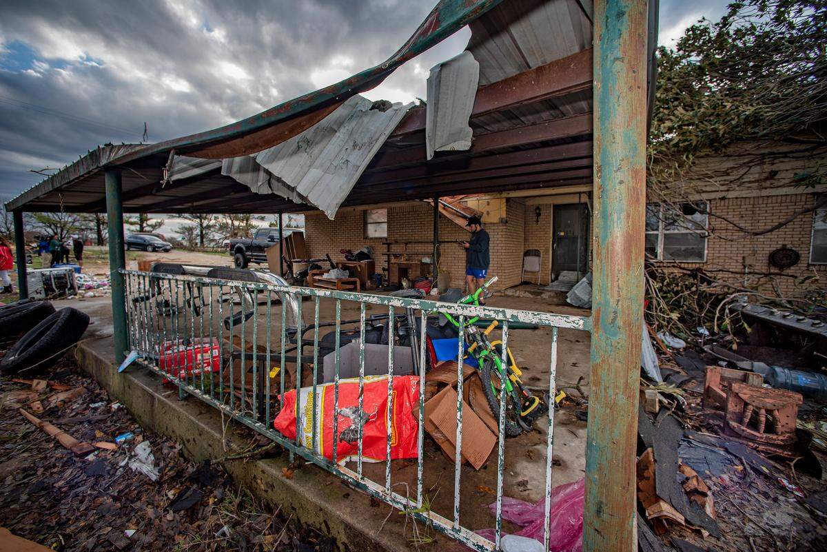 A tornado touched down just south of Decatur, Texas, along FM 730 early morning Tuesday, Dec. 13, 2022, tearing the roof off of a home and ripping trees in half. Debris was strewn across the highway.
